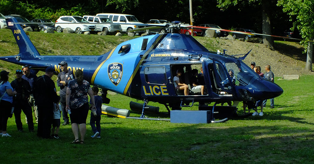 Kids got a chance to sit in a helicopter from the New York City Environmental Protection Agency. The $5 million machine is one of two that keep watch over the reservoirs in the mid-Hudson region that supply water to the city.